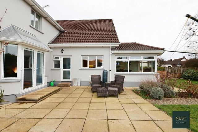 Outside features include a patio and mature south facing rear garden
