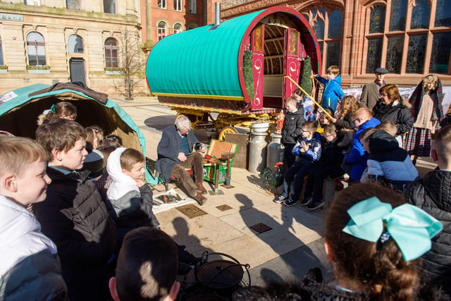 Longtower Primary School pupils see a demonstration of crafting by tinsmith Tom McDonald.
