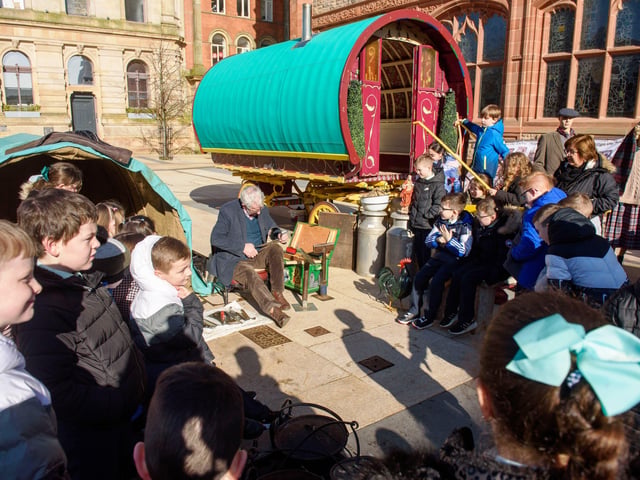 Longtower Primary School pupils see a demonstration of crafting by tinsmith Tom McDonald.