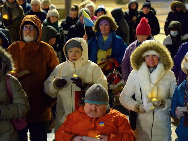 People gather in Guildhall Square on Wednesday evening last for prayers and a candle-lit vigil in solidarity with the people of Ukraine. Photo: George Sweeney. DER2209GS – 025
