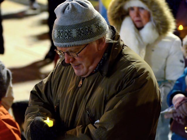 People gather in Guildhall Square on Wednesday evening last for prayers and a candle-lit vigil in solidarity with the people of Ukraine. Photo: George Sweeney. DER2209GS – 028