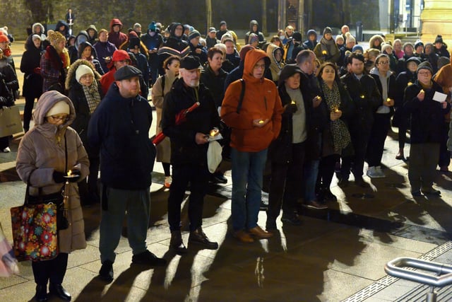 People gather in Guildhall Square on Wednesday evening last during a candle-lit vigil in solidarity with the people of Ukraine.  Photo: George Sweeney.  DER2209GS – 023