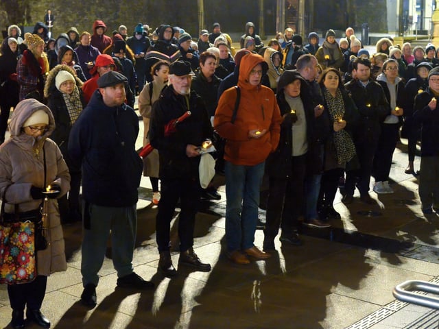 People gather in Guildhall Square on Wednesday evening last during a candle-lit vigil in solidarity with the people of Ukraine. Photo: George Sweeney. DER2209GS – 023