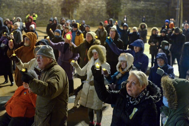 People gather in Guildhall Square on Wednesday evening last during a candle-lit vigil in solidarity with the people of Ukraine.  Photo: George Sweeney.  DER2209GS – 034