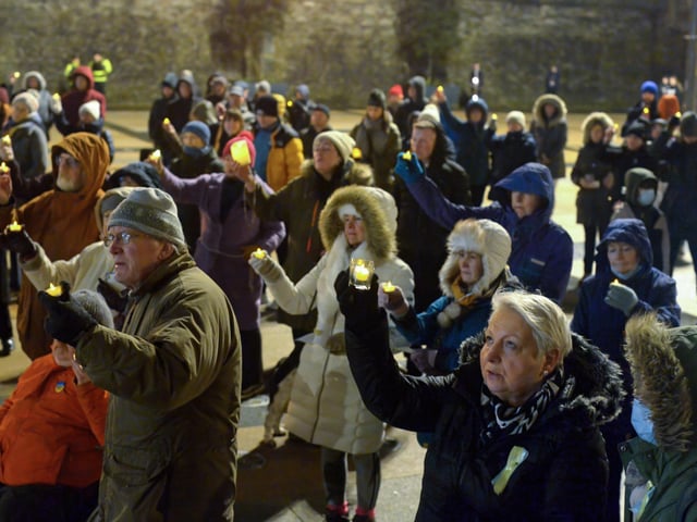 People gather in Guildhall Square on Wednesday evening last during a candle-lit vigil in solidarity with the people of Ukraine. Photo: George Sweeney. DER2209GS – 034