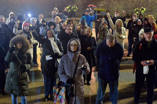 People gather in Guildhall Square on Wednesday evening last during a candle-lit vigil in solidarity with the people of Ukraine.  Photo: George Sweeney.  DER2209GS – 032