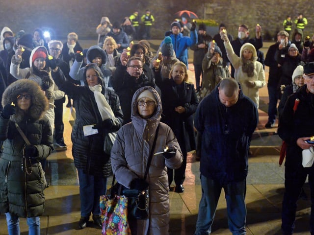 People gather in Guildhall Square on Wednesday evening last during a candle-lit vigil in solidarity with the people of Ukraine. Photo: George Sweeney. DER2209GS – 032