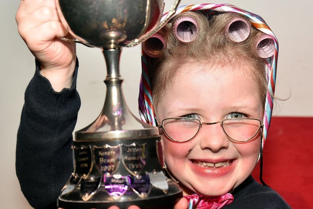 A Real Character...Chloe McDowell (6) proudly shows off her trophy for the Most Promising Performer Under 8 Years. INPT10-213,