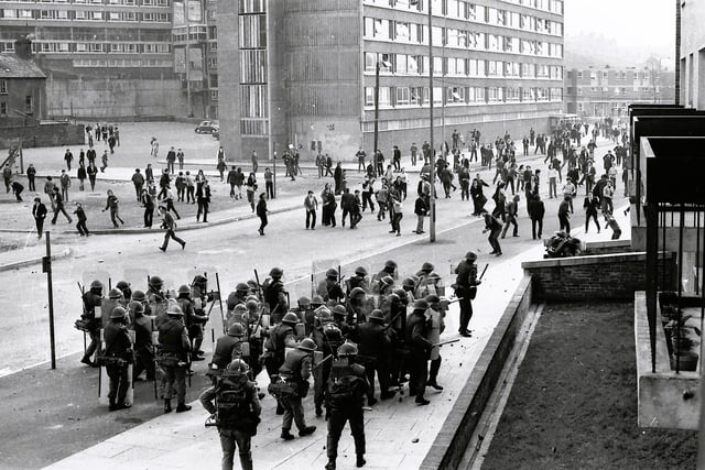 1971... British soldiers and rioters confront each other at Rossville Street.