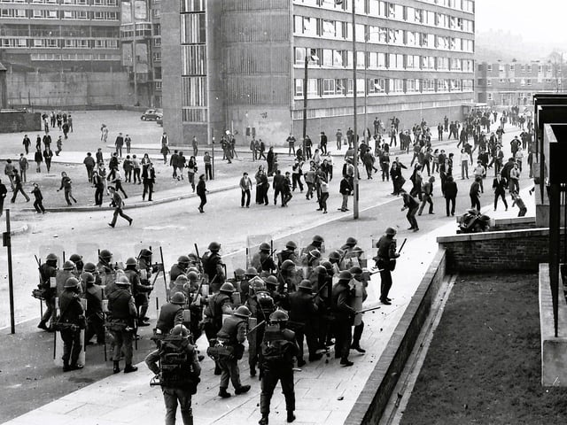 1971... British soldiers and rioters confront each other at Rossville Street.
