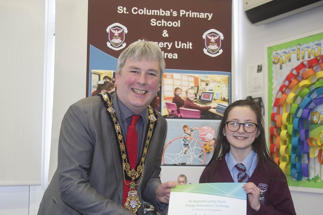 The Mayor of Causeway Coast and Glens Borough Council Councillor Richard Holmes presents a certificate to Lucy Donaghy who took part in the Energy Innovation Challenge