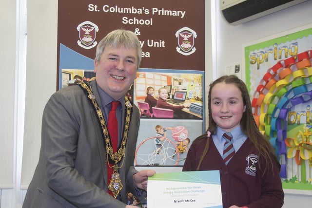 The Mayor of Causeway Coast and Glens Borough Council Councillor Richard Holmes presents a certificate to Lucia McBride who took part in the Energy Innovation Challenge