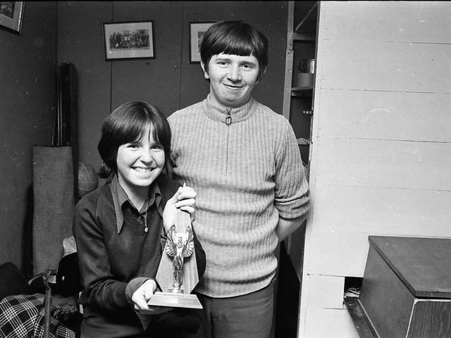 1974... Bernadette Ward, Parkhead Youth Club's Girl of the Year, receives her trophy from Donal Ferry,