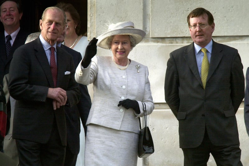 Britain's Queen Elizabeth 2nd accompanied by her husband The Duke of Edinburgh (left) and Northern Ireland First Minister, David Trimble on the steps of Stormont Parliament buildings in Belfast, Northern Ireland this evening, during her Golden Jubliee tour of the UK.