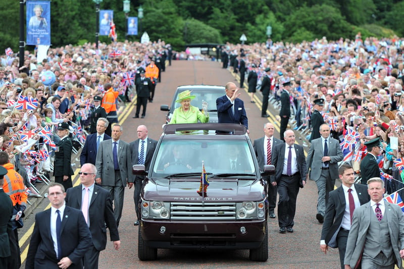 Her Majesty the Queen and Prince Phillip at Stormont as they drove around the grounds watched by thousands