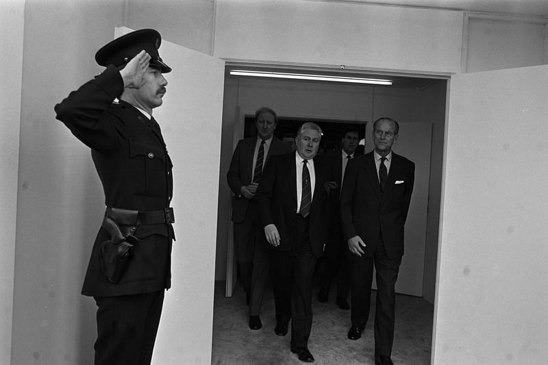 An RUC oficer salutes Prince Phillip as he enters the Kings Hall to officially open the 1991 Ulster Motor Show During his swift one day visit.