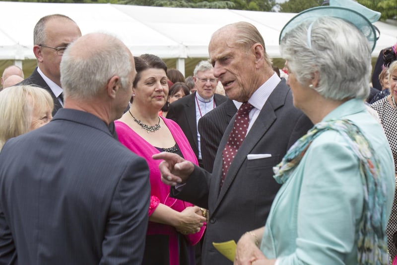 Prince Philip, Duke of Edinburgh meets guests during a garden party held at Hillsborough Castle on day two of their visit on June 24, 2014.  (Photo by Liam McBurney - Pool/Getty Images)