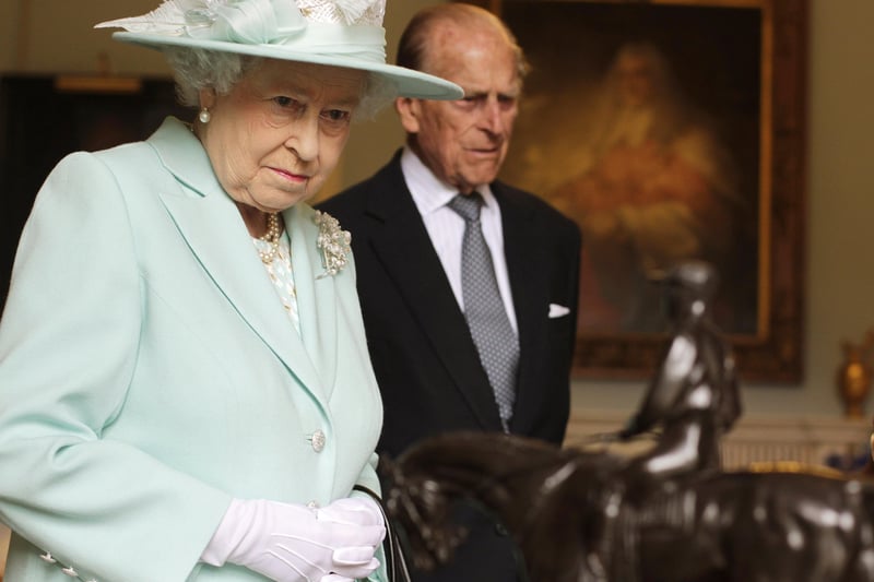 Queen Elizabeth II and Prince Philip, Duke of Edinburgh visit Hillsborough Castle during filming of Antiques Roadshow, on the third and final day of the Queen's visit to Northern Ireland, on June 25, 2014( Photo by Brian Lawless - WPA Pool/Getty Images)