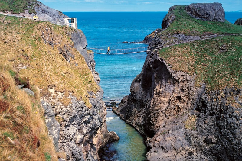 Carrick-a-Rede Rope Bridge near Ballintoy, County Antrim. The bridge links the mainland to the tiny Carrick Island. Salmon fishermen have been erecting bridges to the island for over 300 years.