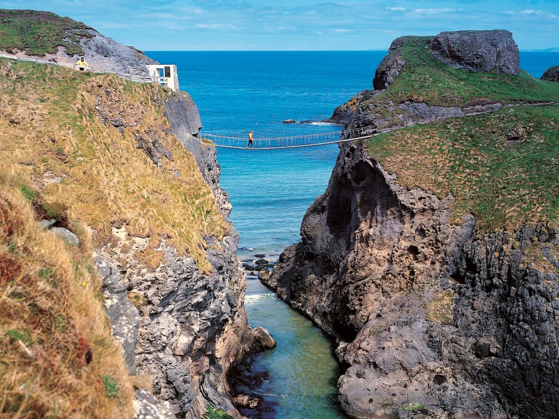 Carrick-a-Rede Rope Bridge near Ballintoy, County Antrim. The bridge links the mainland to the tiny Carrick Island. Salmon fishermen have been erecting bridges to the island for over 300 years.