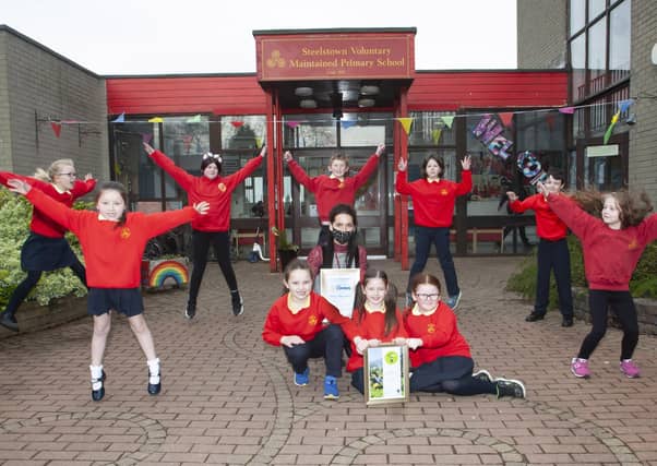 Miss Bronagh Lynch pictured with some of the pupils from Steelstown PS celebrate their achievement in the FairAware School awards this week. Kneeling, front centre are Aoife Lynch, Niah Barnfield and Maya O'Doherty. Standing from left are Hannah O'Neill, Niaya McCafferty, Ava McGill, Andrew O'Doherty, Lola Foy (Eco Committee President), Braeden Rush (Eco Committee Vice President) and Elsa Kehoe.
