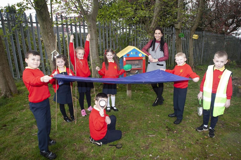 Steelstown PS teacher Miss Bronagh Lynch pictured with some of her class this week at the school Eco Garden where they have been learning outdoors as part of Forest Schools. Included from left are Matis McCarron, Faith Gillespie-McCloskey, Farrah Mooney, Niah Barnfield, Jacob McCollum, Jordan Starrs and Ronan Stewart.