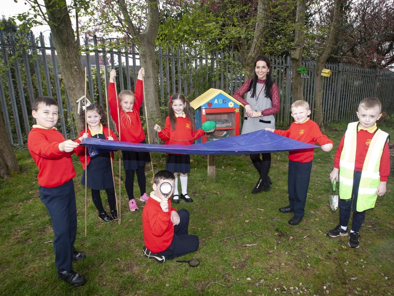 Steelstown PS teacher Miss Bronagh Lynch pictured with some of her class this week at the school Eco Garden where they have been learning outdoors as part of Forest Schools. Included from left are Matis McCarron, Faith Gillespie-McCloskey, Farrah Mooney, Niah Barnfield, Jacob McCollum, Jordan Starrs and Ronan Stewart.