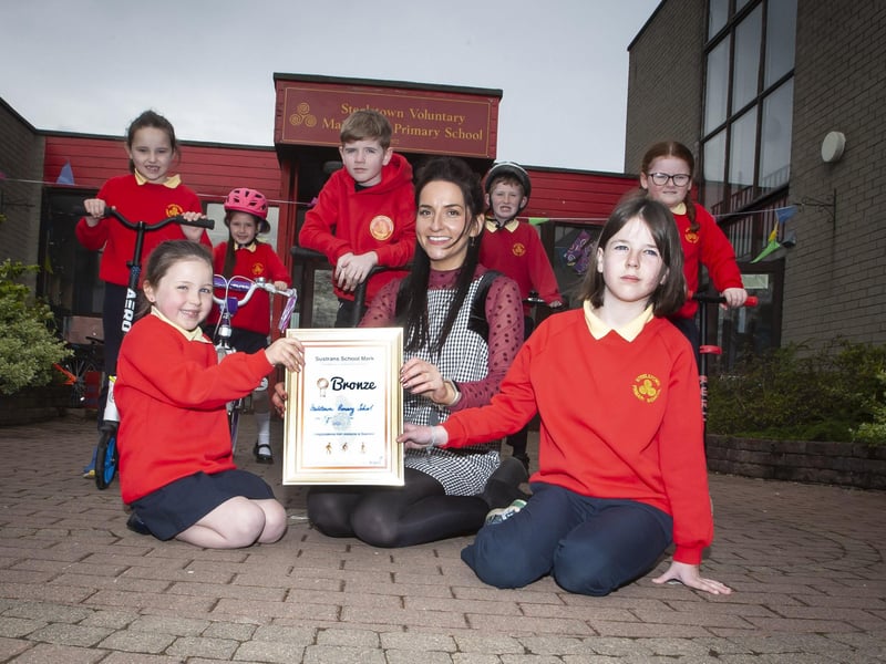 Miss Bronagh Lynch, teacher pictured with pupil representatives after picking up the â€ ̃Sustrans School Markâ€TM bronze award this week. Included are Naiya McCafferty, Aoife Lynch, Niah Barnfield, Riley McColgan, Andrew O'Doherty, Maya O'Doherty and Lola Foy.