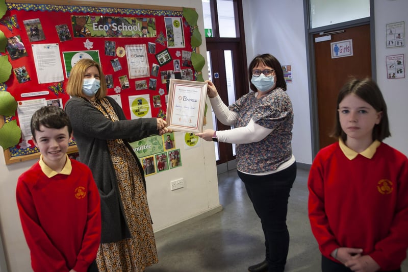 Some of the pupils from Steelstown PS celebrate their achievement in The Green Flag School Award. Mrs Victoria O'Neill and Mrs Donna McGlinchey pictured with Braeden Rush (Eco Committee Vice President) and Lola Foy (Eco Committee President). (Photos: Jim McCafferty Photography)