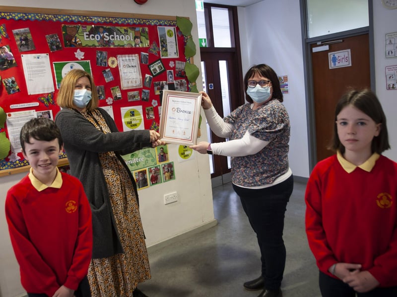 Some of the pupils from Steelstown PS celebrate their achievement in The Green Flag School Award. Mrs Victoria O'Neill and Mrs Donna McGlinchey pictured with Braeden Rush (Eco Committee Vice President) and Lola Foy (Eco Committee President). (Photos: Jim McCafferty Photography)