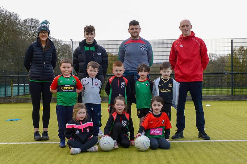 Doire Trasna nursery footballers pictured with coaches Nicole Simpson, Conor Kirkpatrick, Sean Fleming and Patrick McCarry during training recently at the Foyle Arena. DER2115GS – 050