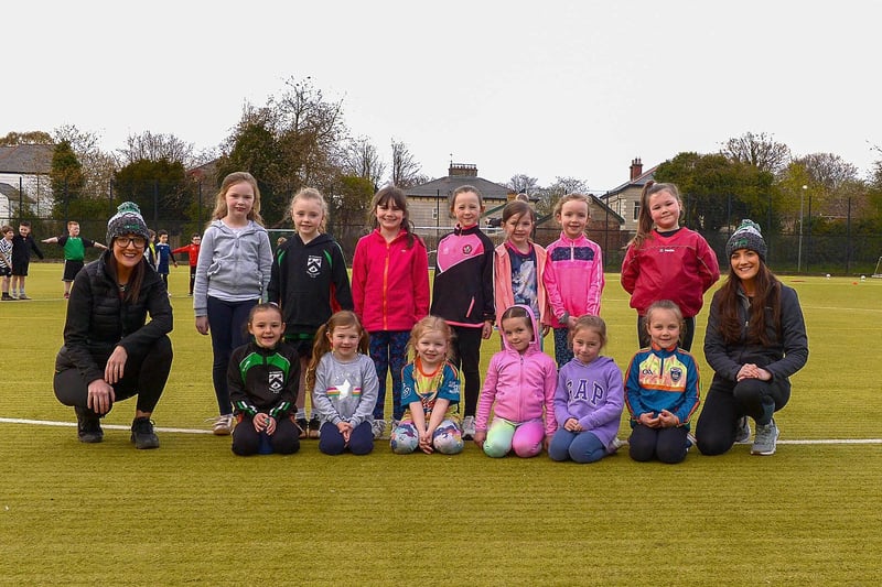 Doire Trasna coaches Nicole and Áine Simpson pictured with nursery footballers  at a training session recently at the Foyle Arena. DER2115GS – 051