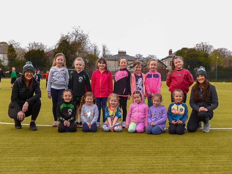 Doire Trasna coaches Nicole and Áine Simpson pictured with nursery footballers at a training session recently at the Foyle Arena. DER2115GS – 051