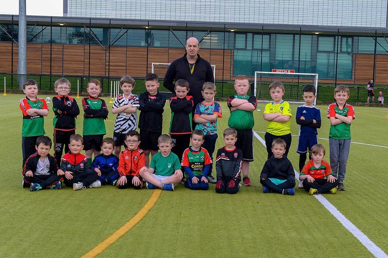 Paul Simpson, Doire Trasna coach, pictured with nursery footballers during a training session at the Foyle Arena recently. Photos: George Sweeney. DER2115GS – 052