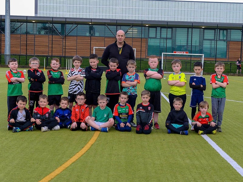 Paul Simpson, Doire Trasna coach, pictured with nursery footballers during a training session at the Foyle Arena recently. Photos: George Sweeney. DER2115GS – 052