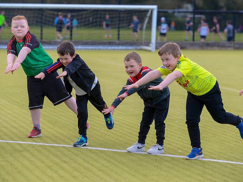Doire Trasna nursery footballers do stretching exercises during a training session at the Foyle Arena recently. DER2115GS – 064