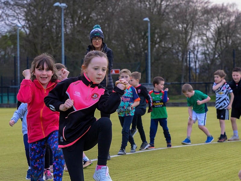 Doire Trasna nursery footballers doing warm-up exercises during a training session at the Foyle Arena recently. DER2115GS – 066