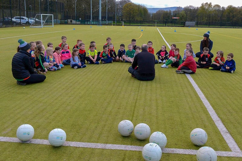 Doire Trasna coach Nicole, Paul and Áine Simpson meet nursery footballers during a training session recently at the Foyle Arena. DER2115GS – 072