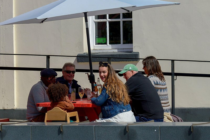 Customers enjoy drink outdoors as lockdown restrictions were further eased on Friday last. Photo: George Sweeney / Derry Journal.  DER2117GS - 055