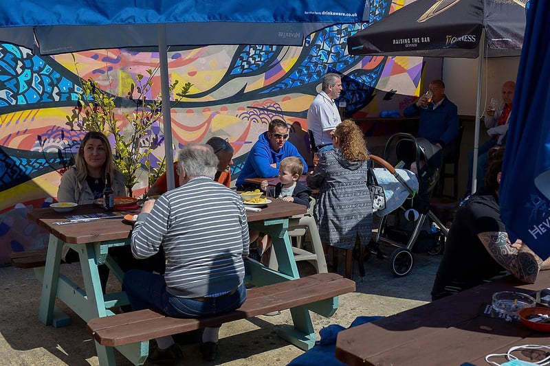 Customers enjoy lunch in the sunshine as pubs with outdoor service reopened on Friday last. Photo: George Sweeney / Derry Journal.  DER2117GS - 047