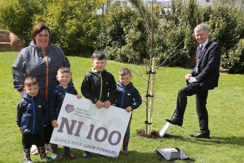 The Mayor of Causeway Coast and Glens Borough Council Alderman Mark Fielding plants a native oak tree at Flowerfield Park in Portstewart with Mayoress Mrs Phyllis Fielding and their grandchildren Tommy, Harvey, Jack and Freddie