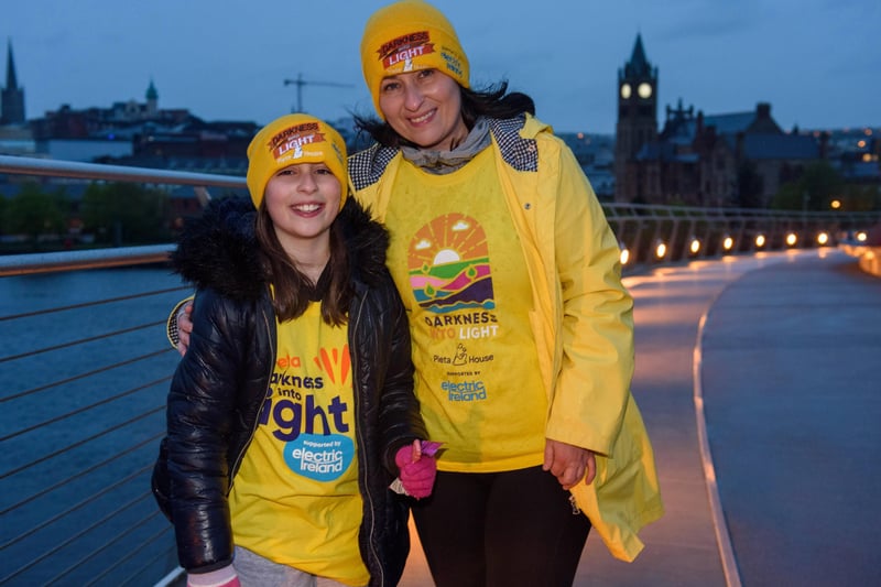 One Sunrise Together, Edelle O'Donnell and her daughter Saorla 10, pictured in Derry during the Pieta Darkness Into Light 2021 sunrise walk supported by Electric Ireland, as they remember Edelle's nephew Ryan McAleer and aunt, Josie Mc Menamin. Thousands of people across Ireland joined together, while apart, under one sunrise on Saturday morning to offer hope to those impacted by suicide and to raise vital funds to ensure Pieta and its partner Northern Ireland charities can continue to provide their life-saving services.