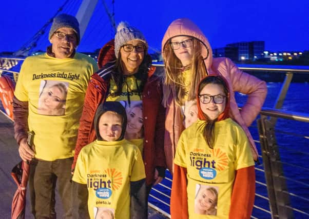 One Sunrise Together, Eugene McDaid with Jacob, Nicola, Keeli and Sophie, in memory of Simone, pictured in Derry during the Pieta Darkness Into Light 2021 sunrise walk supported by Electric Ireland. Thousands of people across Ireland joined together, while apart, under one sunrise on Saturday morning to offer hope to those impacted by suicide and to raise vital funds to ensure Pieta and its partner Northern Ireland charities can continue to provide their life-saving services.