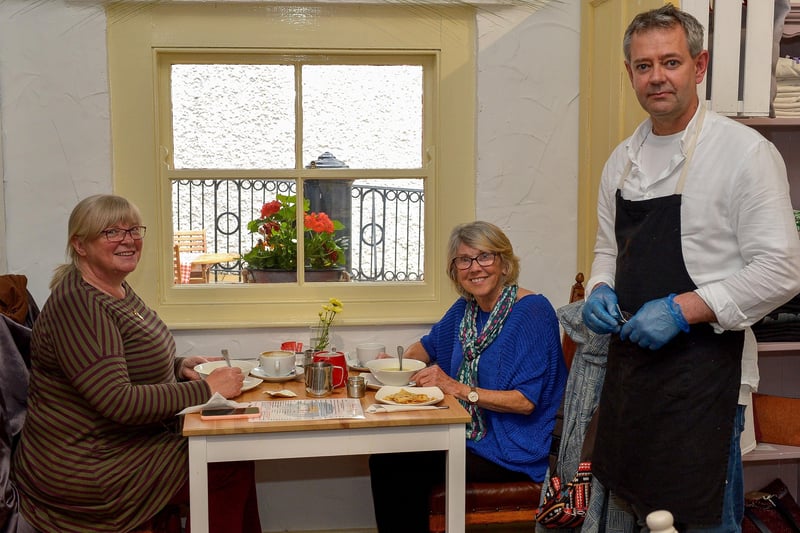 Chef Henk Swiegers pictured with customers Cathy Mullan and Mary Ellen Bell in the Cottage Café in the Craft Village last summer as restriction were eased.  Again it will be table service only from Monday. DER2027GS – 007