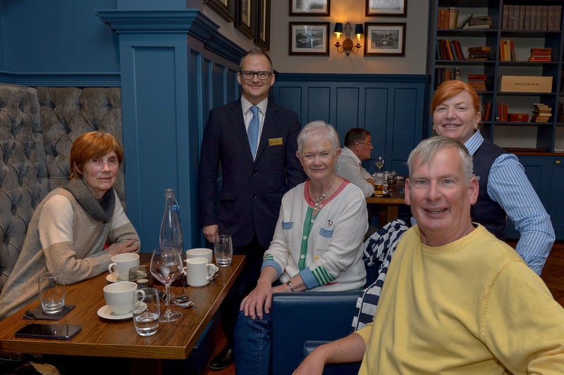 July 2020: Group pictured dining in Bishop's Gate Hotel as restrictions were eased last summer. Six people from different households will be able to sit together to dine or have a drink at cafes, restaurants and pubs from Monday.