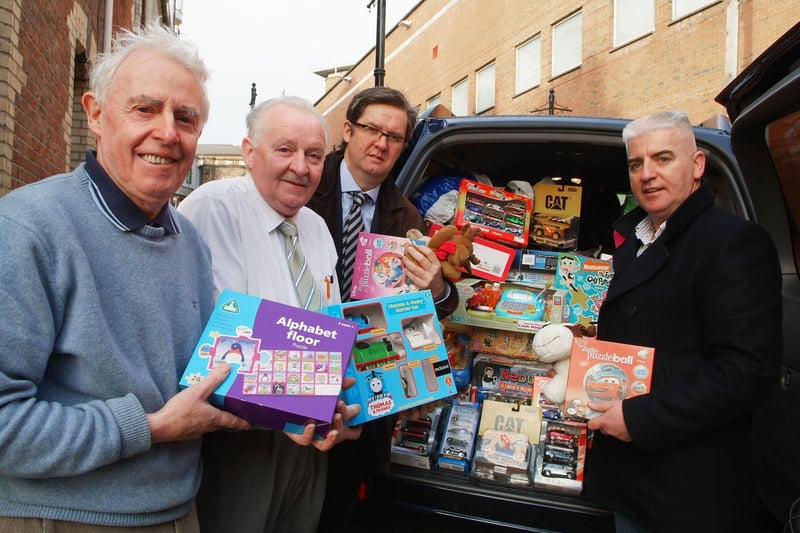 Eamon Gee, third from left, and John McMonagle, right, of the Londonderry Rotary Club, who delivered a car load of toys for the St. Vincent de Paul Christmas Appeal, pictured with Brian Sharkey and Cormac Wilson, St. Vincent de Paul. LS51-184KM