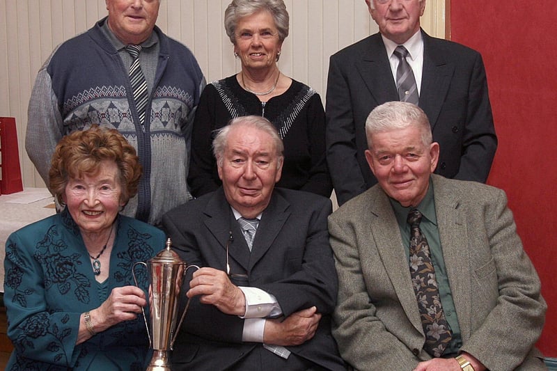 Club trophy winners at the Counties Bridge Club's annual dinner and club presentation of awards held in The Masonic Hall, Londonderry. Seated are Eileen Russell and Alan Moyne, collecting the Counties trophy from Ciaran McFeeley (centre), club president and standing are (from left), Joe Begley, collecting the Vi Black (Scratch) cup and Florence McClintock and Ken McClintock, collecting the President's Prize. LS49-513MT.