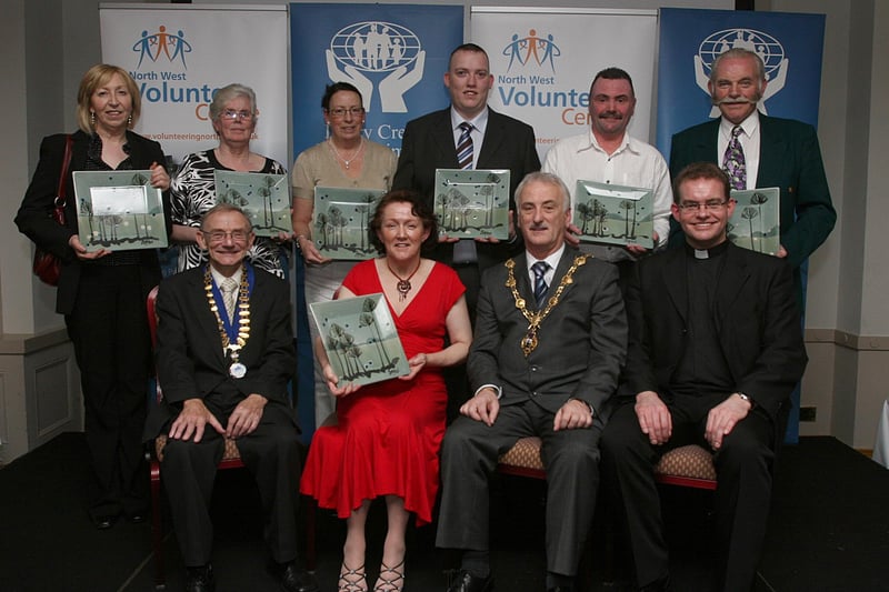 Representatives from local volunteer organisations collecting their prizes at the Foyle Volunteer Awards held in The Everglades Hotel. From left (seated) are Jim Travers, president, Derry Credit Union, sponsors, Debbie Caulfield, the Mayor of Londonderry Alderman Drew Thompson, and Rev. Fr. Dermot McGill, chairman, North West Volunteer Centre.  Standing, Helen Davis, collecting on behalf of Anna Hynman, Rose White, Patricia Glenn, Brian Hasson, Darren Peoples and Hector Magee. LS50-550MT.