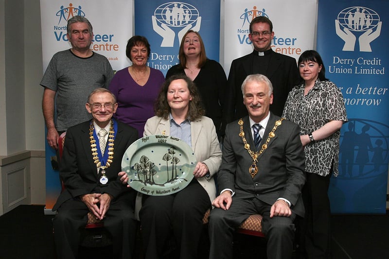 Members from 'Mind Yourself' Volunteers, collecting prizes at the Foyle Volunteer Awards held in The Everglades Hotel. From left (seated) are Jim Travers, president, Derry Credit Union, sponsors, Kitty O'Kane, and the Mayor of Londonderry Alderman Drew Thompson. Standing, Daniel Farren, Evelyn McGettigan, Marie Hetherington, Rev. Fr. Dermot McGill, chairman, North West Volunteer Centre and Catrina McLaughlin. LS50-551MT.