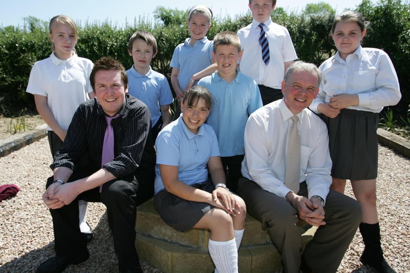 Ashlea PS principal Mr William McElhinney (right) with P7 class teacher Alan McClarty and his P7 students.  (0807JB81)